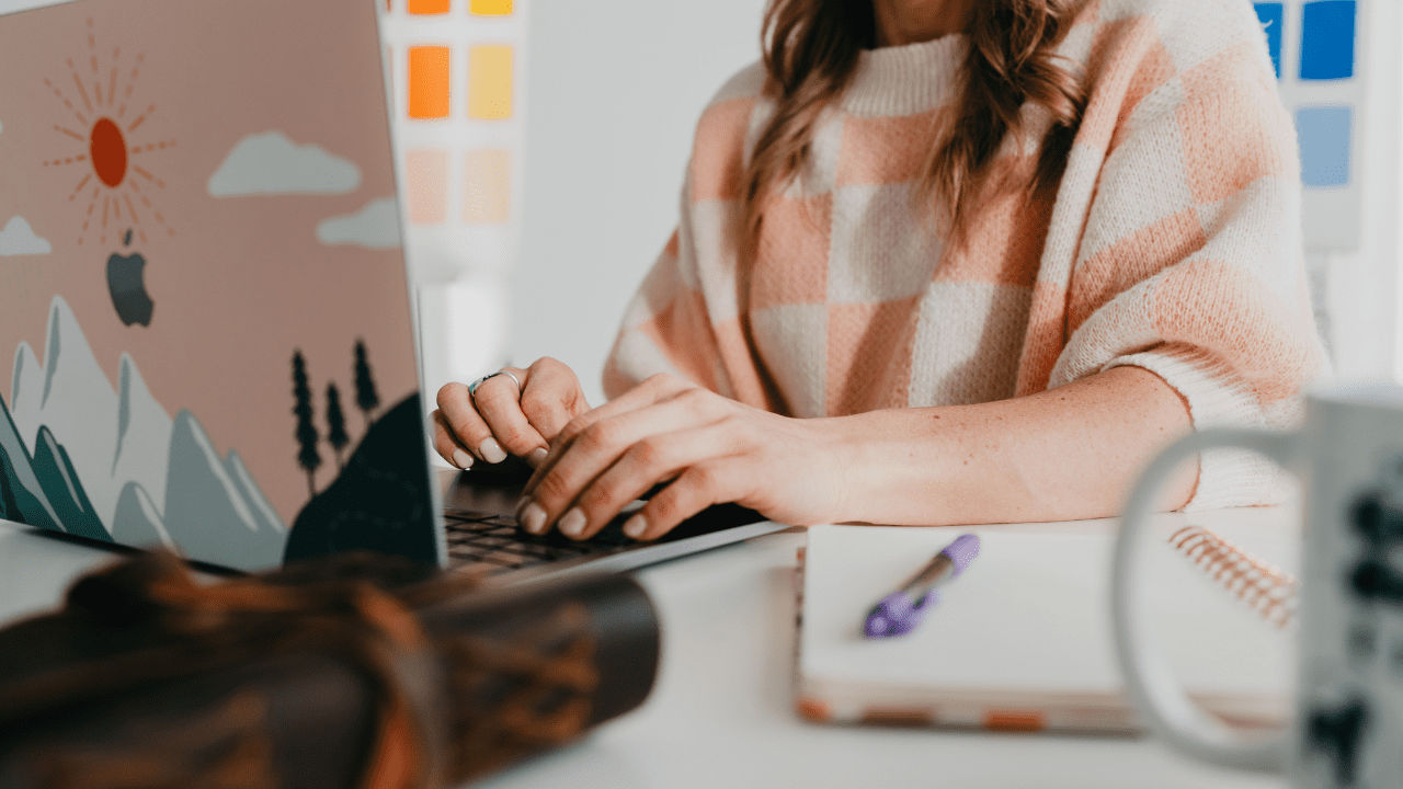 Fraser Web Design LLC, signs it's time to update your website, woman in pink and white sweater working on computer